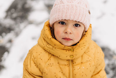 Portrait of cute girl in snow