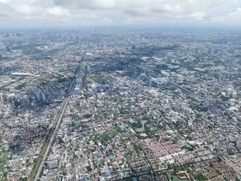 Aerial view of cityscape against sky