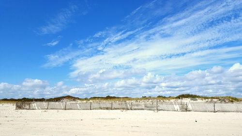 Scenic view of landscape against cloudy sky