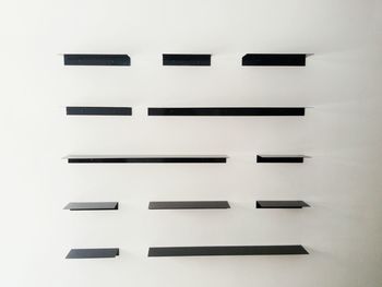 Close-up of clock over white background