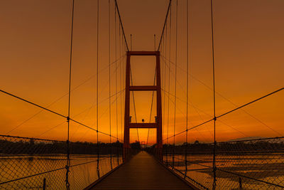 Golden hours sunset with rope bridge