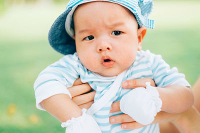 Cropped image of mother holding baby boy