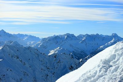 Scenic view of snowcapped mountains against sky