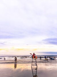 Scenic view of beach against sky during sunset