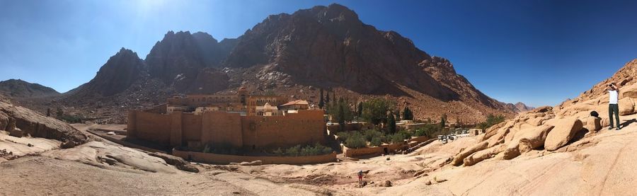 Panoramic view of rocky mountains against sky