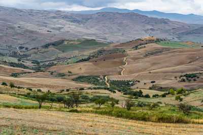 High angle view of field against mountains