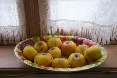 High angle view of fruits in plate on table