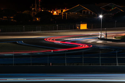 Light trails on road in city at night