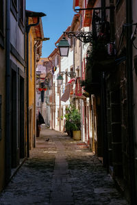 Narrow alley amidst buildings in city