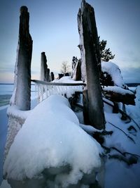 Snow covered landscape against sky