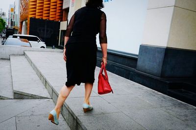 Woman standing in city