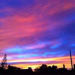 Low angle view of dramatic sky during sunset