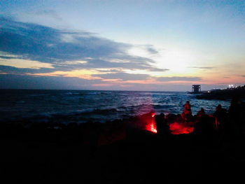 Silhouette of people on beach