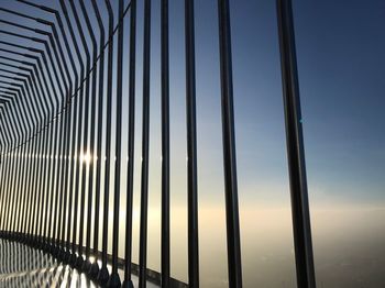 Full frame shot of railing against sky seen through window