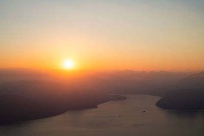 Scenic view of desert against sky during sunset