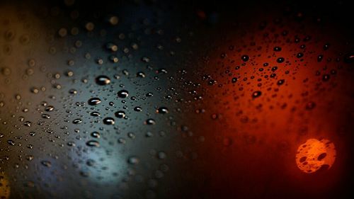 Close-up of water drops on glass