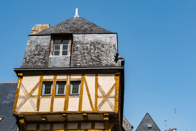 Low angle view of colorful timber-framed medieval house in historic centre of vannes, brittany