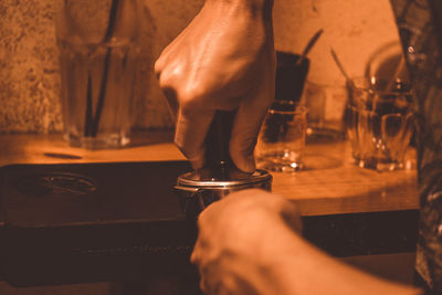 Close-up of man with drink on table