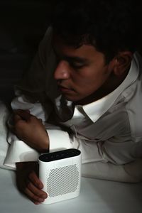 Young man holding coffee cup