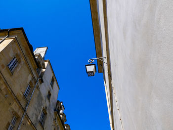 Low angle view of building against clear blue sky