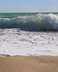 Scenic view of beach against clear sky