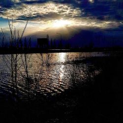 Reflection of clouds in water at sunset