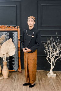 Men wearing traditional javanese clothes