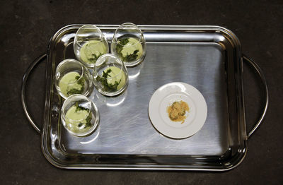 High angle view of food and drink in tray on table