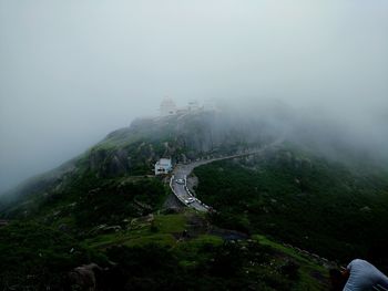 Scenic view of mountains against sky during foggy weather