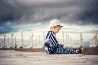 Full length of man sitting on beach