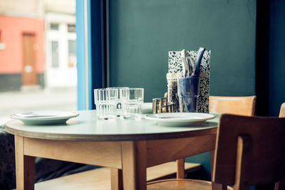 Empty chairs and tables in restaurant