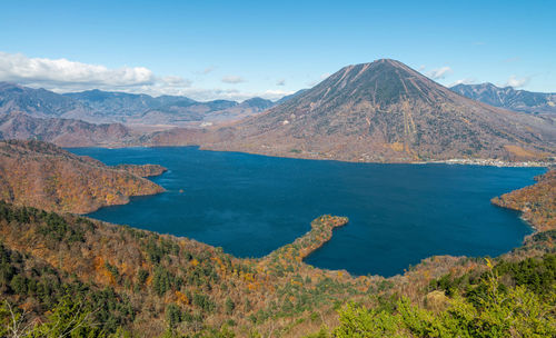 Panoramic view of lake chuzenji and nantai mountain in autumn season.