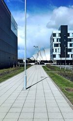 Buildings against cloudy sky