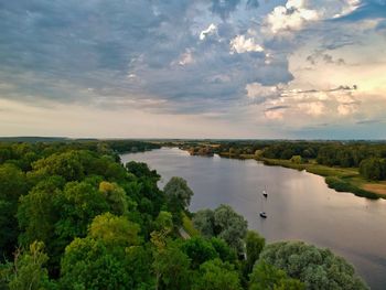 High angle view of trees by sea against sky