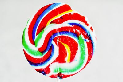 Close-up of multi colored fruits against white background