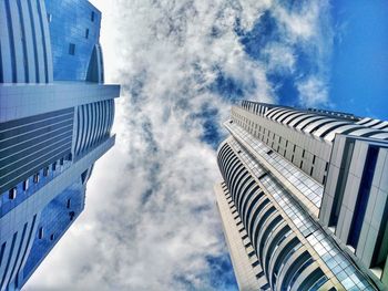 Low angle view of modern buildings against sky