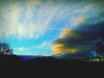 Scenic view of landscape against cloudy sky