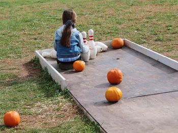 Children playing bowling at park