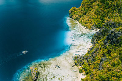 High angle view of rocks by sea