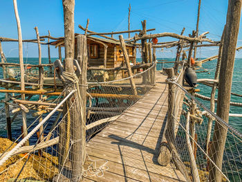 Bridge over sea against sky