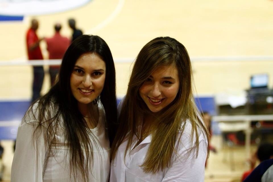 lifestyles, person, looking at camera, portrait, young adult, leisure activity, smiling, happiness, young women, focus on foreground, headshot, front view, casual clothing, togetherness, toothy smile, head and shoulders, long hair