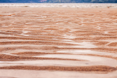 Close-up of sand at beach