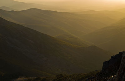 Scenic view of mountains against sky during sunset