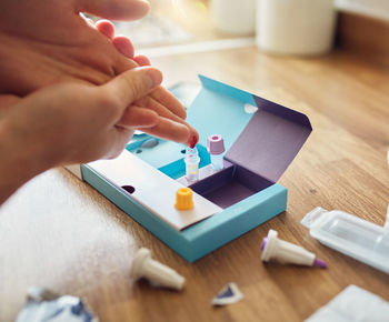 High angle view of baby playing with toy on table
