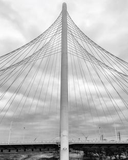 Low angle view of modern building against cloudy sky