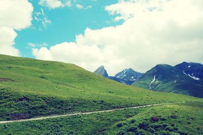 Scenic view of landscape against cloudy sky