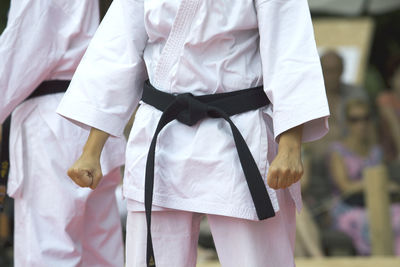 Midsection of man standing on hand