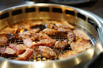 High angle view of meat on barbecue grill