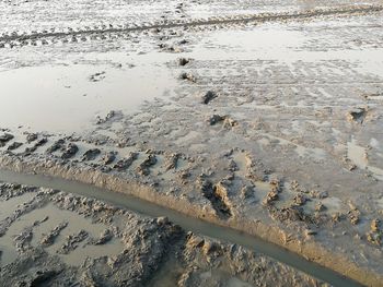 High angle view of wet sand on beach
