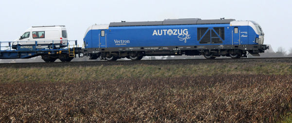 Train on railroad track against sky